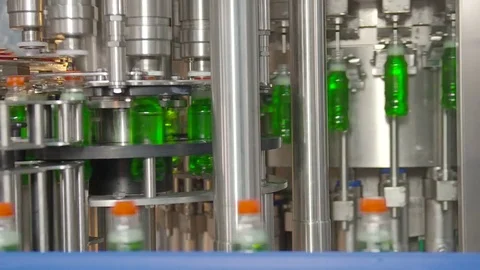 Bottling of lemonade in plastic bottles. Lemonade bottle conveyor industry. Video stock 76347745