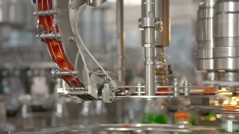 Bottling of lemonade in plastic bottles. Lemonade bottle conveyor industry. Stock Footage 76347799