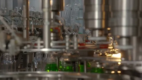 Bottling of lemonade in plastic bottles. Lemonade bottle conveyor industry. Video stock 76348119
