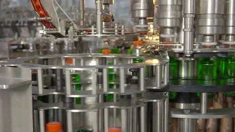 Bottling of lemonade in plastic bottles. Lemonade bottle conveyor industry. Video stock 76348369