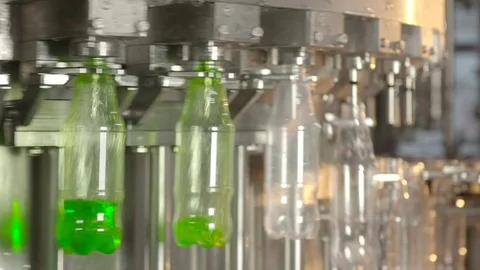 Bottling of lemonade in plastic bottles. Lemonade bottle conveyor industry. Video stock 76348411