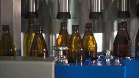 Bottling Line. Brewing technology. Bottles Moving on Conveyor Belt at Glass Vidéo 245277028