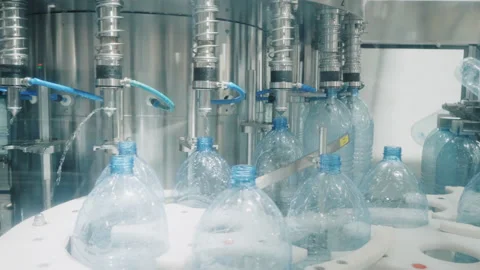 Bottling line transports empty containers to metal taps Stock Footage 160853212