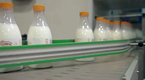 Bottling milk in bottles Stock Footage 64539337