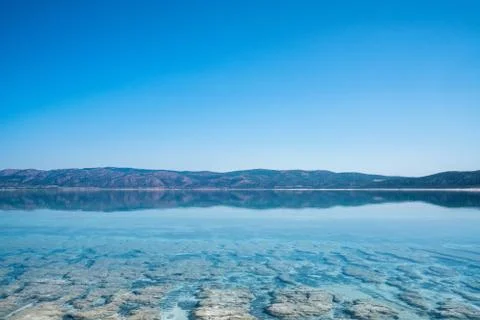 The bottom and surface with crystal clean water of Salda Lake in Turkey. Travel Stock Photos