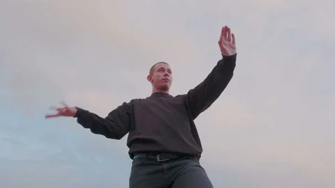 Bottom angle camera view of attractive funky dancer. Man showing modern stylish Stock Footage 105463912