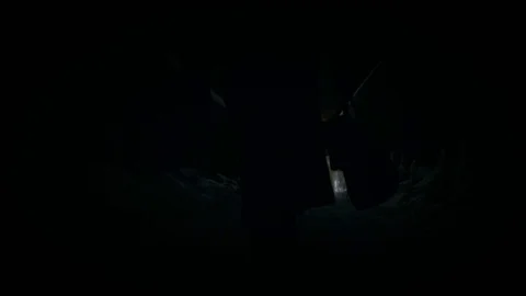 Bottom angle: Man ib black cloak walking through alley Stock Footage 102141129