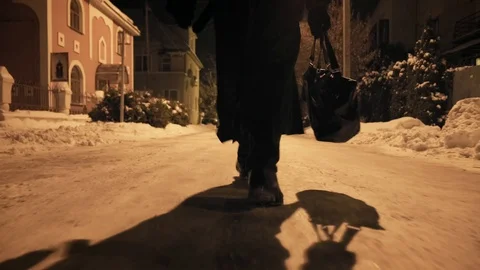 Bottom angle: Man ib black cloak walking through alley Stock-Footage 103364924