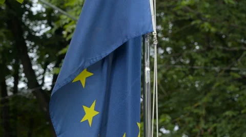 The bottom of the blue flag on the pole Stock Footage 66226894