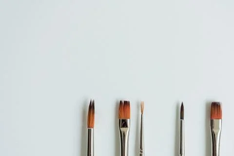 At the bottom, on a clean white sheet, there are brushes for drawing with pai Stock Photos