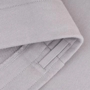 Bottom with drawstrings of light gray sweatshirt Stock Photos