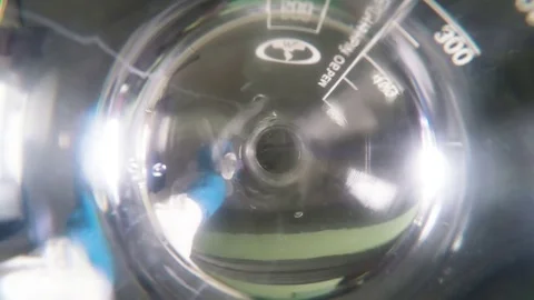 Bottom Lab Assistant Drops Puprle Liquid in Water Macro Stock Footage 84923365