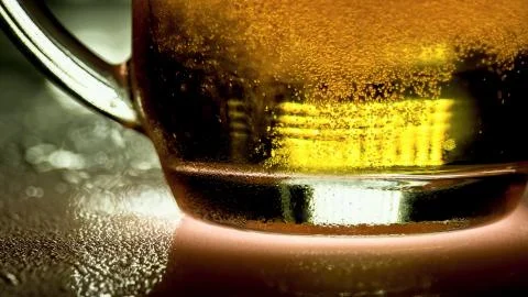 Bottom of the mug with beer Stock Photos