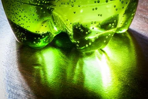 The bottom part of a plastic bottle with water Stock Photos