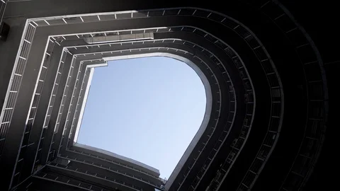 A bottom perspective of rounded shaped building. Real estate. Modern building Vídeos de archivo 129854155