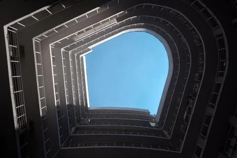 A bottom perspective of rounded shaped building. Real estate. Modern building Fotos de archivo