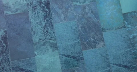 Bottom of pool with blue mosaic tiles on background of wall Stock Footage 246998864