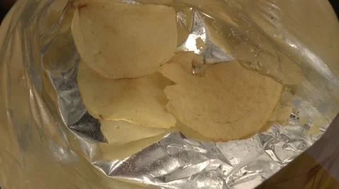 Bottom of Potato Chip Bag, Hand Reaches In, closeup Stock Footage 55521944