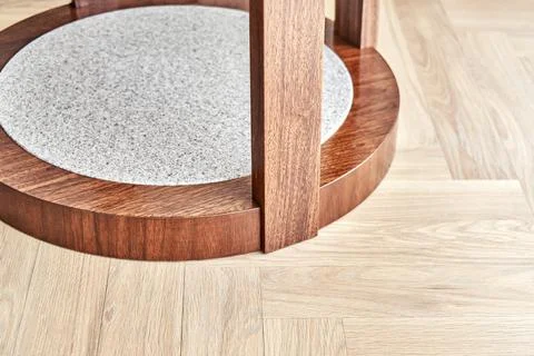 Bottom of round coffee table of walnut with acrylic detail Stock Photos