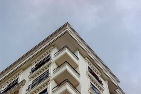 Bottom-up shoot of classical ecclectic style of mass housing with iron detail Stock Photos