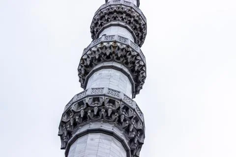 Bottom shoot of islamic forms ornamented marble masonry minaret Stock Photos