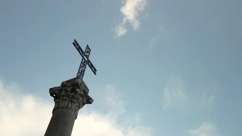 Bottom shot of a crucifix fixed on an ancient column Stock Footage 154415592
