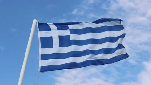 Bottom shot of greece flag with blue open sky background Stock Footage 91950868