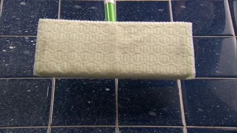 Bottom of swiffer floor cleaner being held up to camera Stock Footage 123849218