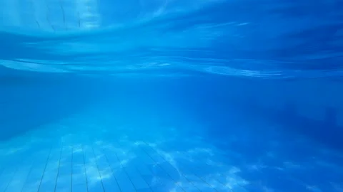 The bottom of the swimming pool. Transparent water background with reflection of Stock Footage 171111151