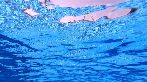 Bottom underwater view of water surface ripples in pool Stock Footage 118235169