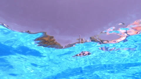 Bottom underwater view of water surface ripples and pool shower Stock Footage 143625809