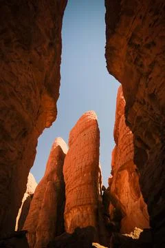 Bottom-up view to Abstract Rock formation at plateau Ennedi aka stone forest in Stock Photos