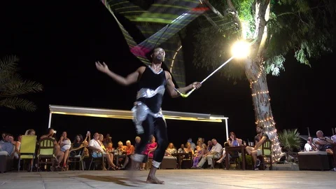 Bottom view on acrobat juggling with a big cube Stock Footage 86009043