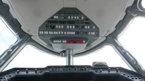 Bottom view of airplane pilots cabin with dashboard control. Aircraft's roof Stock Footage 249685445