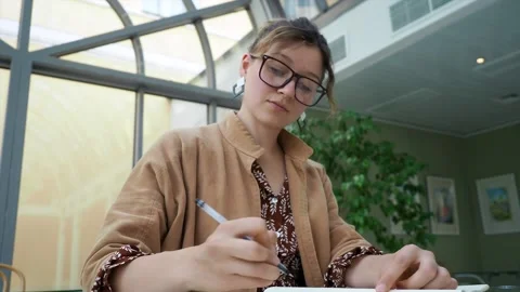 Bottom view. attractive freelance dark hair businesslady with eyeglasses in Stock Footage 147404828