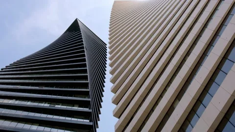 Bottom view beautiful geometric background of two modern office high-rise b.. Stock Footage 237384824