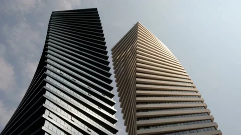 Bottom view beautiful geometric background of two modern office high-rise b.. Stock Footage 237914053