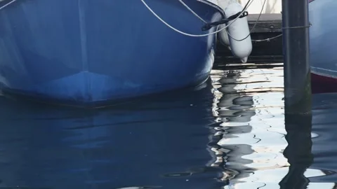 Bottom view of the bow of several sailing boats in port Vídeos de archivo 258812647