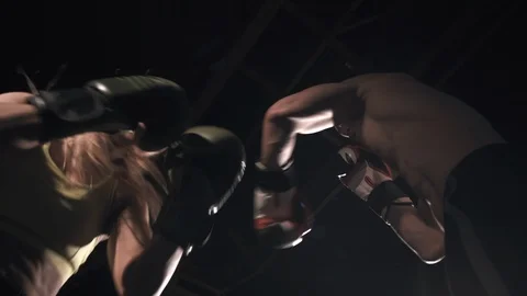Bottom view boxers man and woman fighting together Video stock 112943813