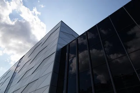 Bottom view of building with triangular pattern and round openings on wall and 스톡 사진