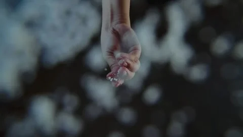 Bottom-up view of a chef's hand sprinkles salt to a dish. Unique perspectiv.. Stock Footage 329703168