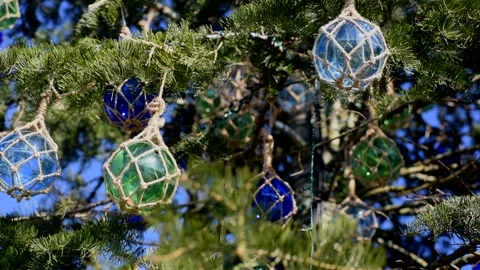 Bottom view of Christmas tree ornaments in motion. Stock Footage 144850811