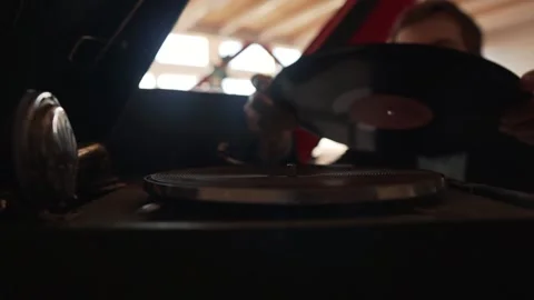 Bottom view. Close up of a man putting a Vinyl on turntable Stock Footage 130869134