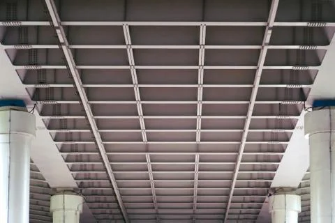 Bottom view of the concrete floors of the big bridge. Square metal cells and  Stock Photos