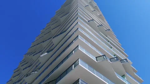 Bottom view of contemporary skyscraper with appealing architectural design set Stock Footage 266946051