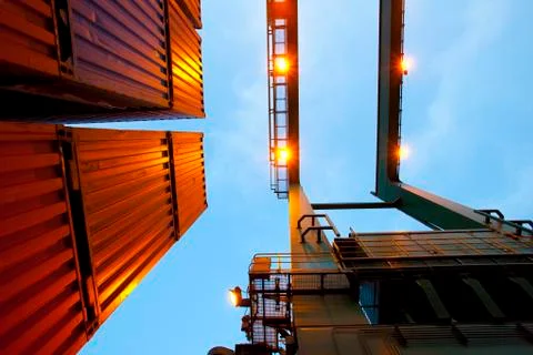 Bottom view of cranes and stack of cargo containers Foto stock