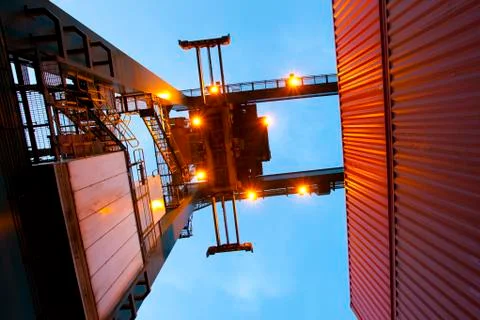 Bottom view of cranes and stack of cargo containers Foto stock