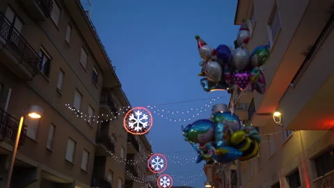 Bottom view of decorated streets in Christmas time, glittering garlands outdoor Stock Footage 163357982
