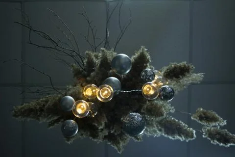 Bottom view of decorative reed cloud hanging from above with a Christmas deco Foto stock