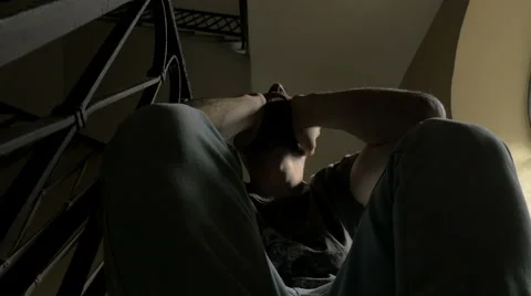 Bottom view of the desperate man held his head with his hands Stock Footage 69016203